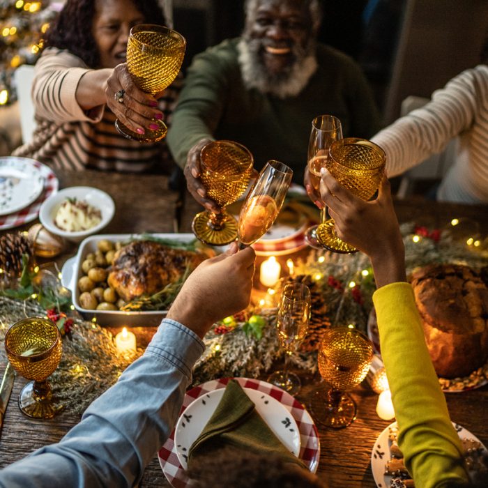 Family toasting on Christmas dinner at home
