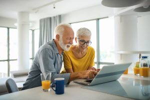 Couple using laptop