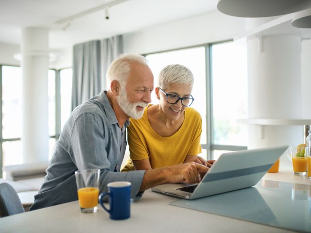 Couple using laptop