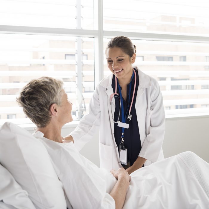 Female consultant smiling and talking with patient