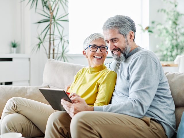 senior couple use tablet