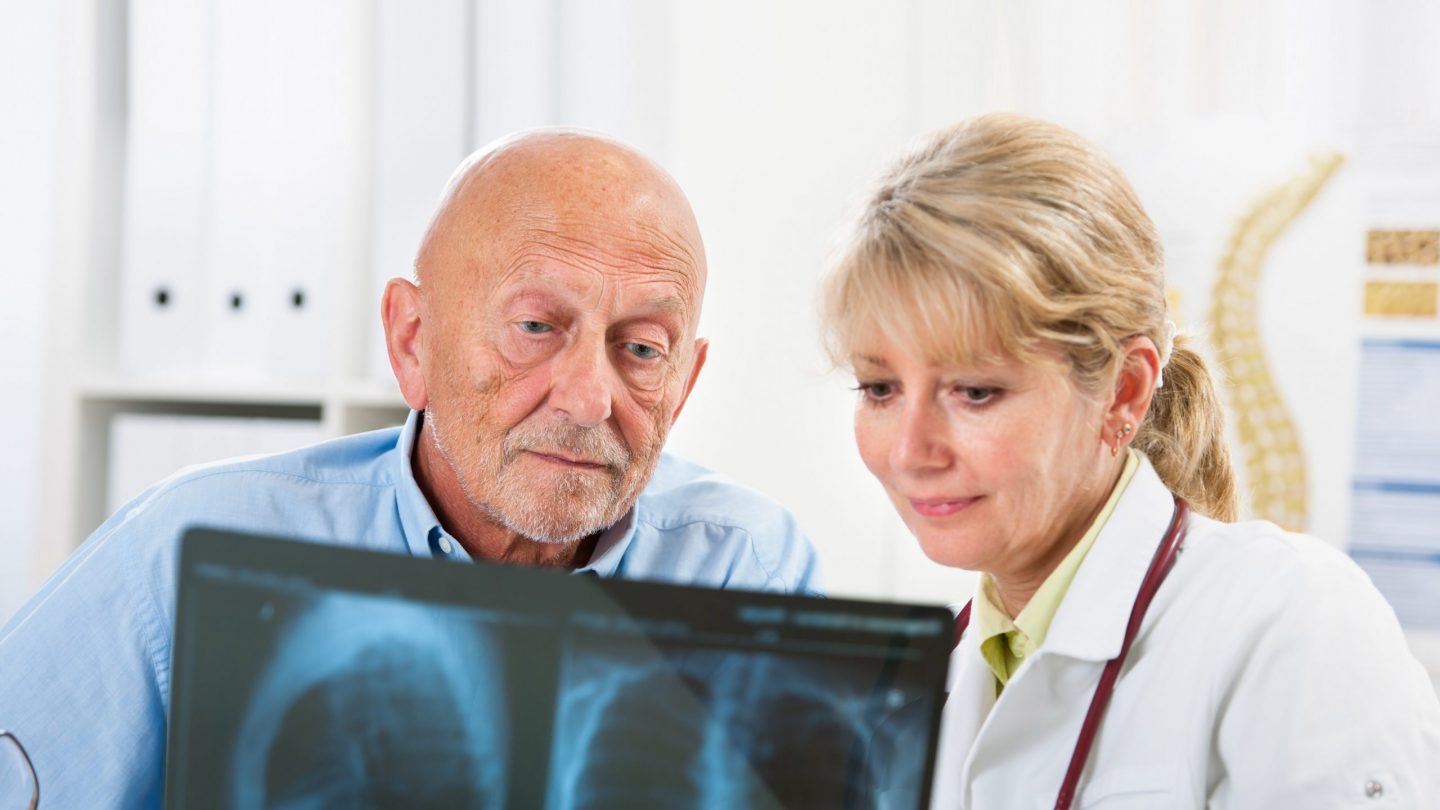Doctor patient looking at x-ray