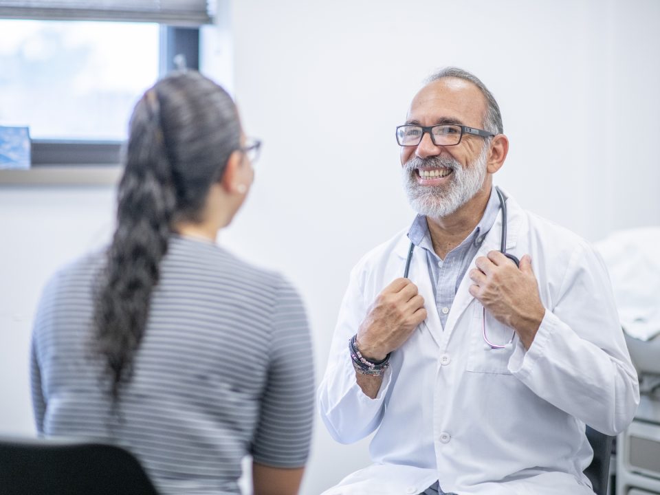 Male Doctor Meets With Female Patient
