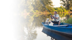 Man fishing with dog